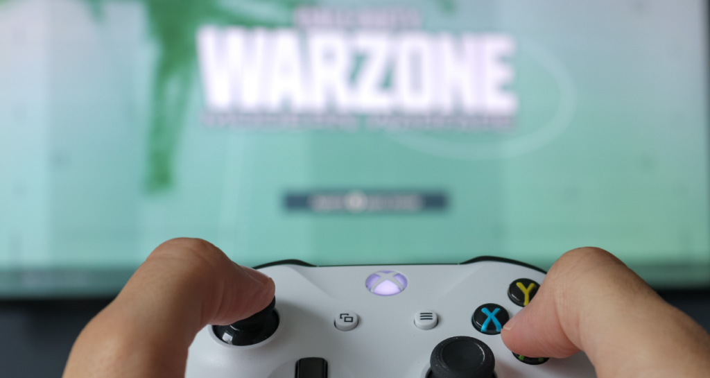 person-playing-warzone-with-controller